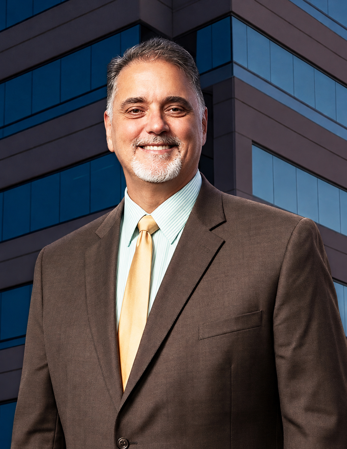 Smiling Executive Against Modern Office Tower